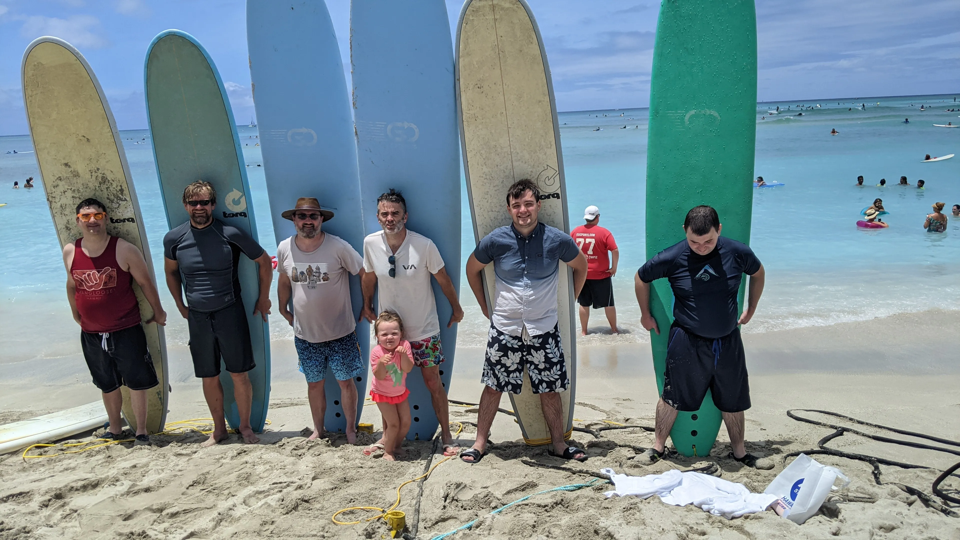 DADO engineering team at the beach with longboards during a team hackathon